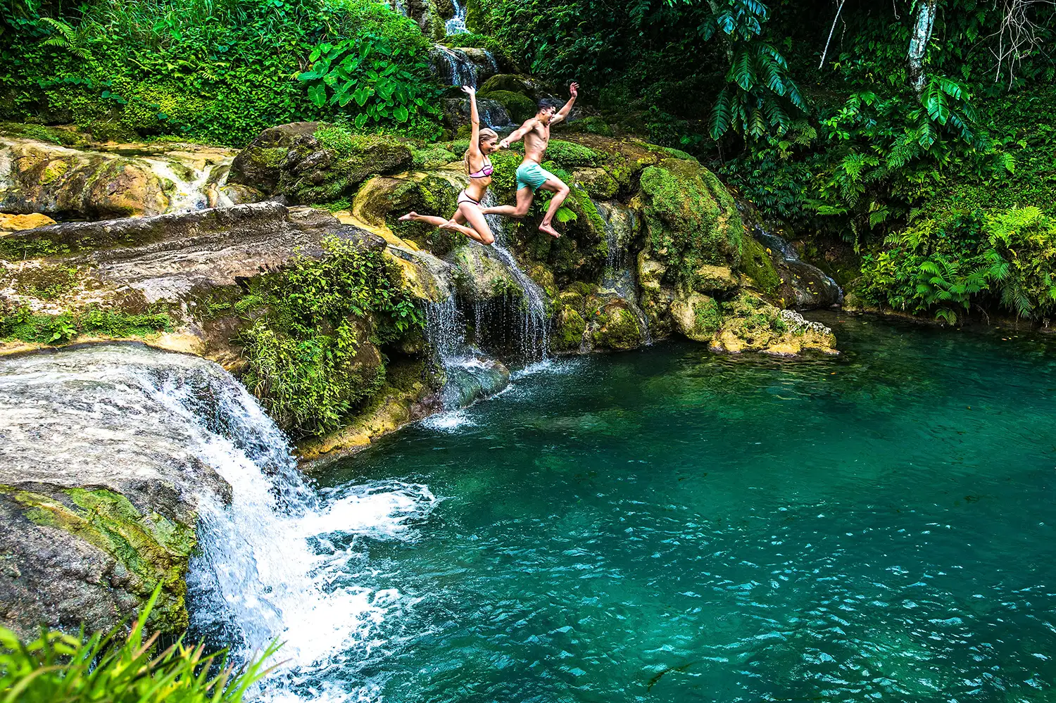 Couples Fun and Adventure at Vanuatu Waterfall with Trees and Fishes